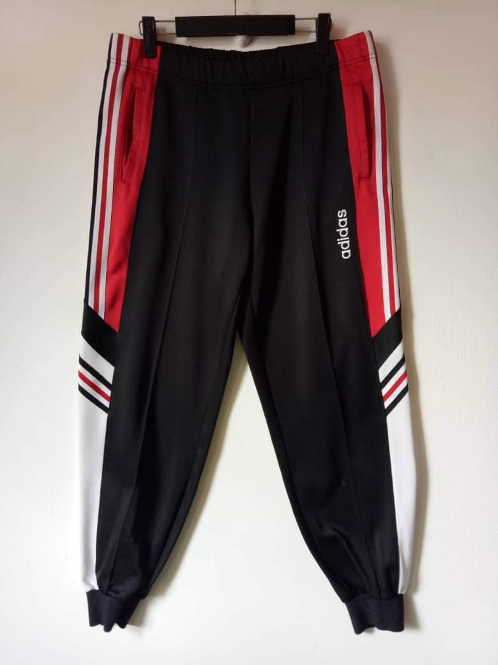 sweatpants with stripes on one leg