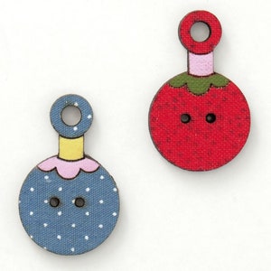 May include: Two wooden buttons with a loop at the top. One button is red with a green stem and white dots, the other is blue with white dots and a pink and yellow trim.