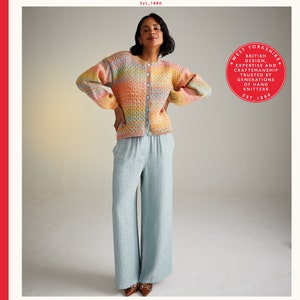 May include: A woman wears a multi-colored striped cardigan with a button closure. The cardigan is made with a chunky yarn and has a relaxed fit. The cardigan is paired with light blue pants. The text "JEWELSPUN" is displayed in a red box below the image. The text "ARAN" is displayed in a smaller red box below the text "JEWELSPUN". The text "81-137cm 32-54in" is displayed in a red box to the right of the text "JEWELSPUN".