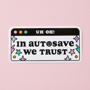 May include: White sticker with a black border and the text "UH OH! In autosave we trust." with a smiley face in the word "autosave". The sticker has a colourful design with stars and lightning bolts.