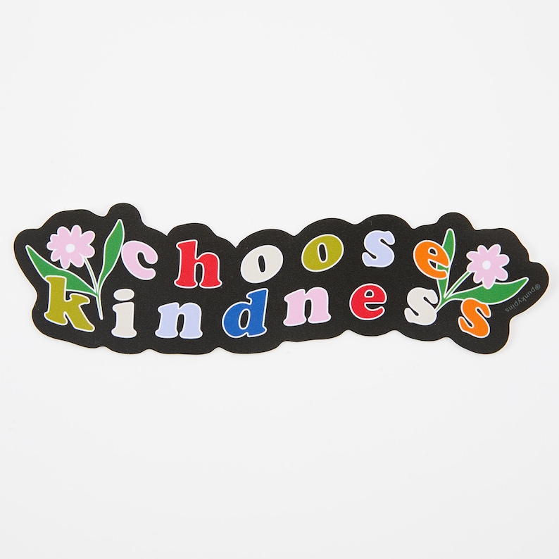 May include: Black sticker with the text "choose kindness" in colorful letters with flowers on either side.
