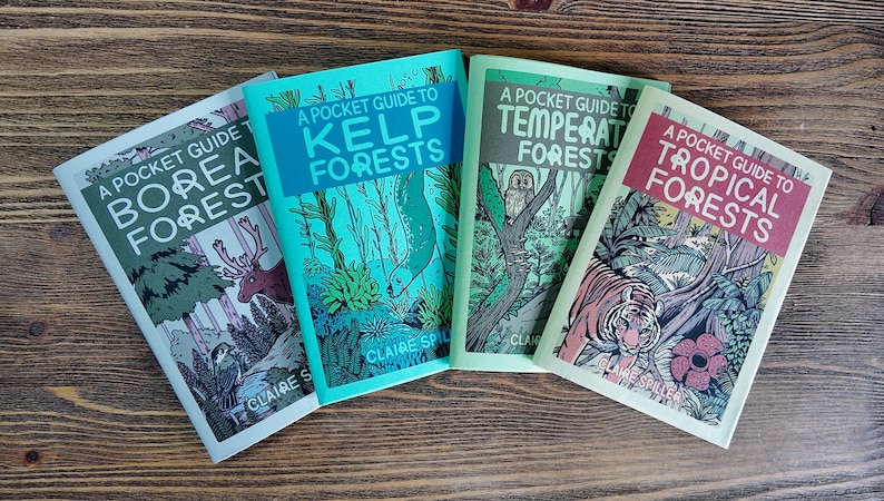 May include: Four softcover books titled A Pocket Guide to Boreal Forests, Kelp Forests, Temperate Forests, and Tropical Forests by Claire Spiller. Each book features a distinct color palette and detailed illustrations of animals and plants.
