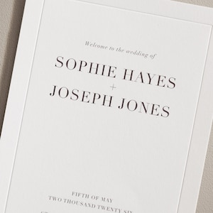 Puede incluir: Invitación de boda con fondo blanco y texto negro. El texto dice "Bienvenido a la boda de Sophie Hayes + Joseph Jones Cinco de mayo Dos mil veintiséis".