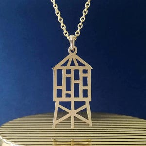 Collar con colgante de torre de agua en tono dorado, colgante con dije del símbolo de Nueva York, joyería llamativa con motivo icónico de la ciudad de Nueva York, cortada a mano.