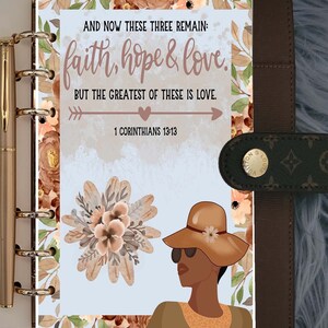 May include: A blue and white planner page with a floral border. The page features a quote from 1 Corinthians 13:13, "And now these three remain: faith, hope & love. But the greatest of these is love."