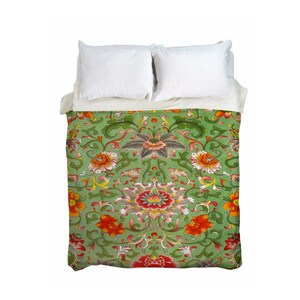 May include: A green duvet cover with a floral pattern featuring red, orange, yellow, and white flowers. The flowers are surrounded by green leaves and vines.