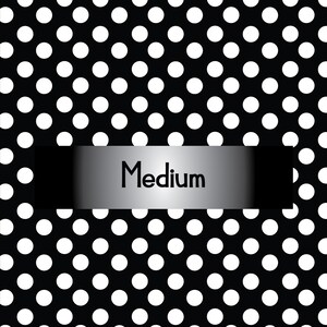 May include: Black and white polka dot pattern with a silver and black banner that says "Medium".