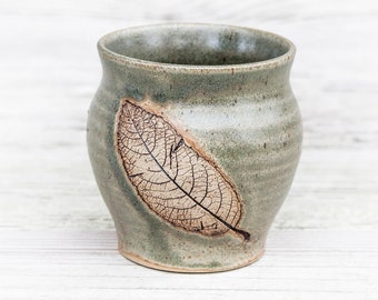 Stoneware tea cup with leaf imprint. Artisan handcrafted, wheel thrown pottery beaker, tumbler, nature lovers cup. Handmade mulled wine cup