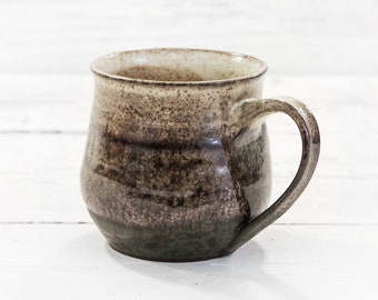Handmade pottery ceramic coffee cup. Modern farmhouse hand thrown organic drinkware. Mid century vibes, natural irregular, forest tone mug