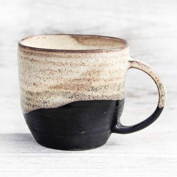 12oz/350ml Handmade pottery mug, for coffee or tea lovers. Unique shaped, black beige, wheel thrown and crumpled ceramic mug. Hygge.