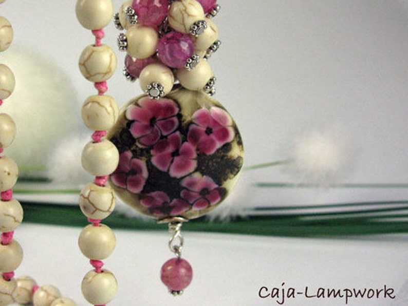 Long chain with very large Lampwork flower bead Howlithperlen knotted