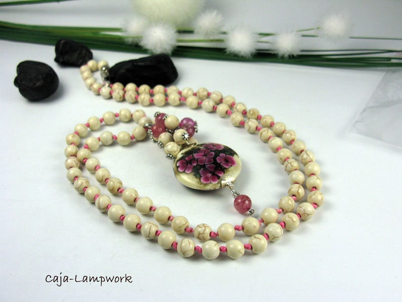 Long chain with very large Lampwork flower bead Howlithperlen knotted