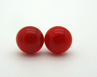 Orange-red lampwork stud earrings with surgical steel plugs, glass ear studs