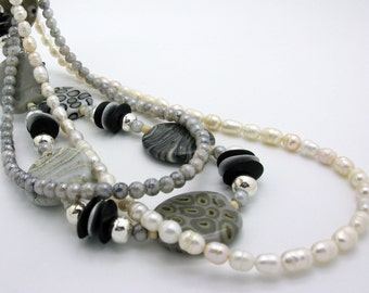 Three long chains with lampwork artist pearls, glass pearls, freshwater cultured pearls, gray ivory rose, 3 chains set in a noble look