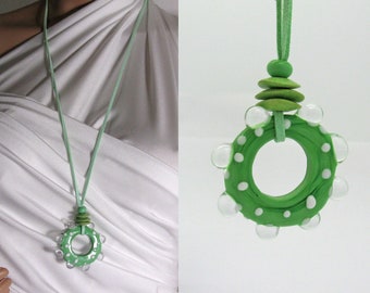 Long, green necklace with large lampwork donut bead