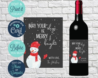 May include: A black wine bottle with a red top and a label featuring a snowman wearing a red hat and scarf. The label reads "May your days be merry & bright" with the text "With love, The Johnstons". Additional text includes "Edit & Print it Today!"