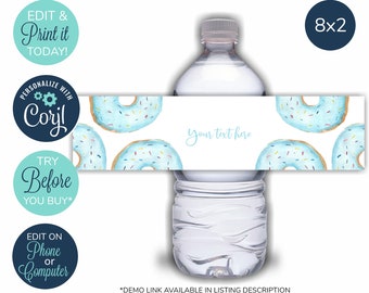 May include: Water bottle label template with a donut theme. The label is white with blue and pink donuts with sprinkles. The text on the label says "Your text here". The label is 8 inches by 2 inches.