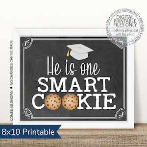 May include: A printable 8x10 inch sign with a chalkboard background. The sign says "He is one SMART COOKIE" with a graduation cap and two chocolate chip cookies.