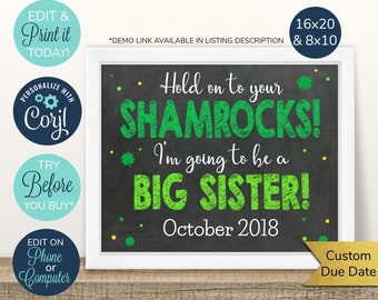 May include: A printable chalkboard style sign with green shamrocks and the text "Hold on to your shamrocks! I'm going to be a big sister! October 2018".