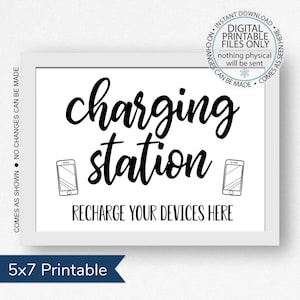 May include: Black and white printable sign that reads "charging station" with two phone icons and the text "Recharge your devices here". The sign is 5x7 inches.