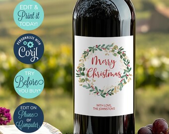 May include: A printable wine bottle label with a watercolor wreath design. The wreath is made of green leaves, gold accents, and red berries. The text "Merry Christmas" is in red lettering inside the wreath. The text "With Love, The Johnstons" is below the wreath.