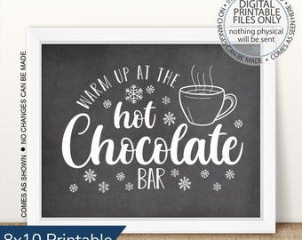 May include: A printable 8x10 inch sign with a chalkboard background and white text that reads "Warm Up At The Hot Chocolate Bar". The sign features a white outline of a mug of hot chocolate with steam coming from it and snowflakes.
