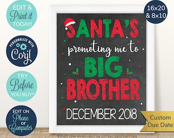 May include: A black chalkboard with white trim, announcing a baby's promotion to big brother. The text reads "Santa's promoting me to BIG BROTHER" in red and green letters. The date "DECEMBER 2018" is written below in white. The sign is available in 16x20 and 8x10 sizes.