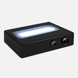 May include: A black rectangular light box with a white light panel and two ports on the side.