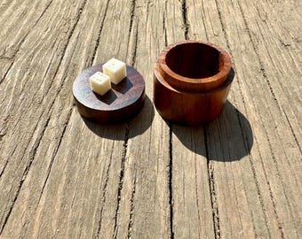 Wooden box with two bone dice