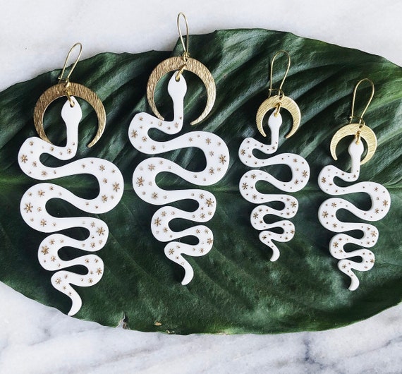 The Serpentine Drop Earrings White Acetate and Gold Stars Laser