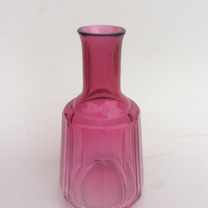 Cranberry glass flask Victorian faceted sides.