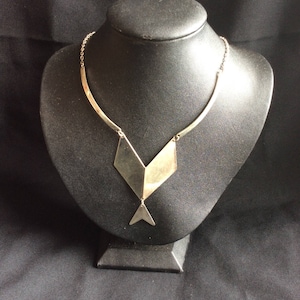 Striking geometric Aztec style silver necklace.