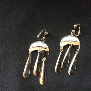 Striking geometric Aztec style silver tone clip earings
