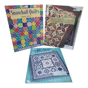 May include: Three quilting books are shown. "Snowball Quilts" by Tammy Kelly features colourful quilt block designs. "Repiecing the Past" by Sara Rhodes Dillow showcases quilt patterns. "All-Star Sampler" displays a star quilt design.