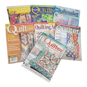May include: A collection of quilting magazines with various titles and colorful covers. Titles include "Quilt Trends," "Quilter," "Quilting Arts," and "Quiltmaker." The magazines feature images of quilts and quilting projects.