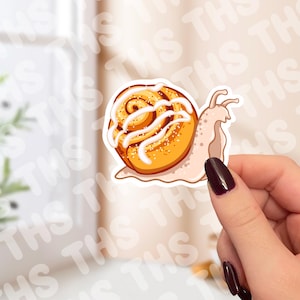 Adesivo de caracol com pão de canela
