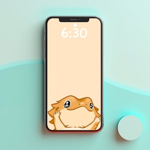 May include: A smartphone with a light peach background and a cartoon image of a brown bearded dragon with big eyes peeking out from the bottom of the screen. The time 6:30 is displayed on the screen.