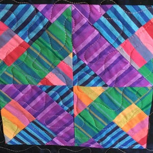 A vibrant, colourful, handmade quilt, Kaffe Fassett woven stripes, non traditional pattern. can be personalized and gift wrapped.  #61