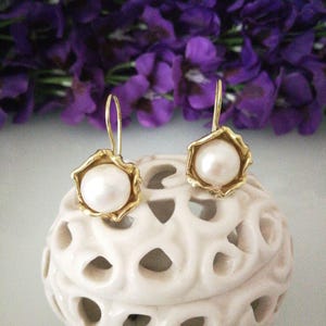 White baroque natural pearl earrings, gold plated leaf silver