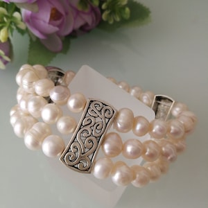 White baroque natural pearl bracelet. Three-strand pearl bracelet.