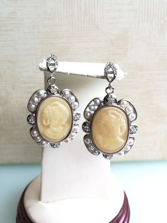 Cameo earrings in worked white coral paste. Vintag