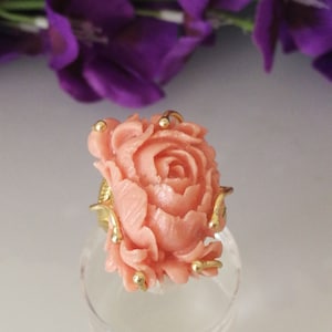 Pink coral ring composed of a Japanese rose in worked coral.