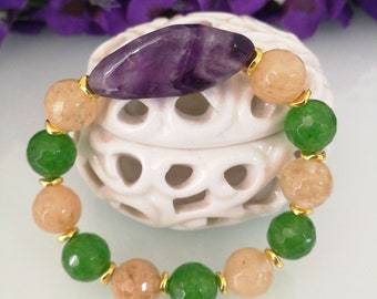 Pulsera de piedra natural con cuarzo citrino y piedra central amatista morada.