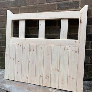 May include: A natural wood gate with a slatted design and a horizontal lattice top. The gate is unfinished and ready to be stained or painted.