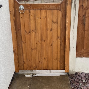Wooden garden gate. Redwood timber. Pedestrian gate.