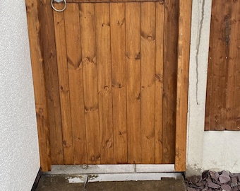 Wooden garden gate. Redwood timber. Pedestrian gate.