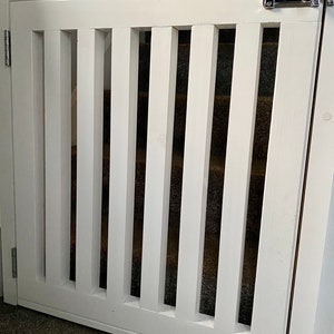 Wooden stair gate. Redwood timber. Dog gate