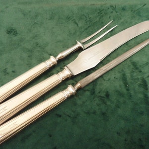 A nice Vintage art deco carving set silver plated handles