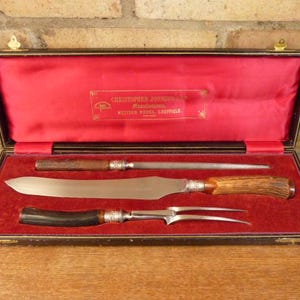 A nice Antique Christopher Johnson carving Knife and fork set deer antler handle cased
