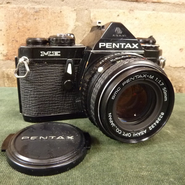 a nice Vintage Pentax ME 35MM SLR camera  1:1.7 50mm  lens